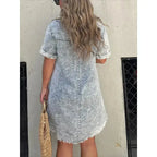 Women’s short sleeve denim button-down dress with raw hem, stylish Trendsi denim dress for casual wear.