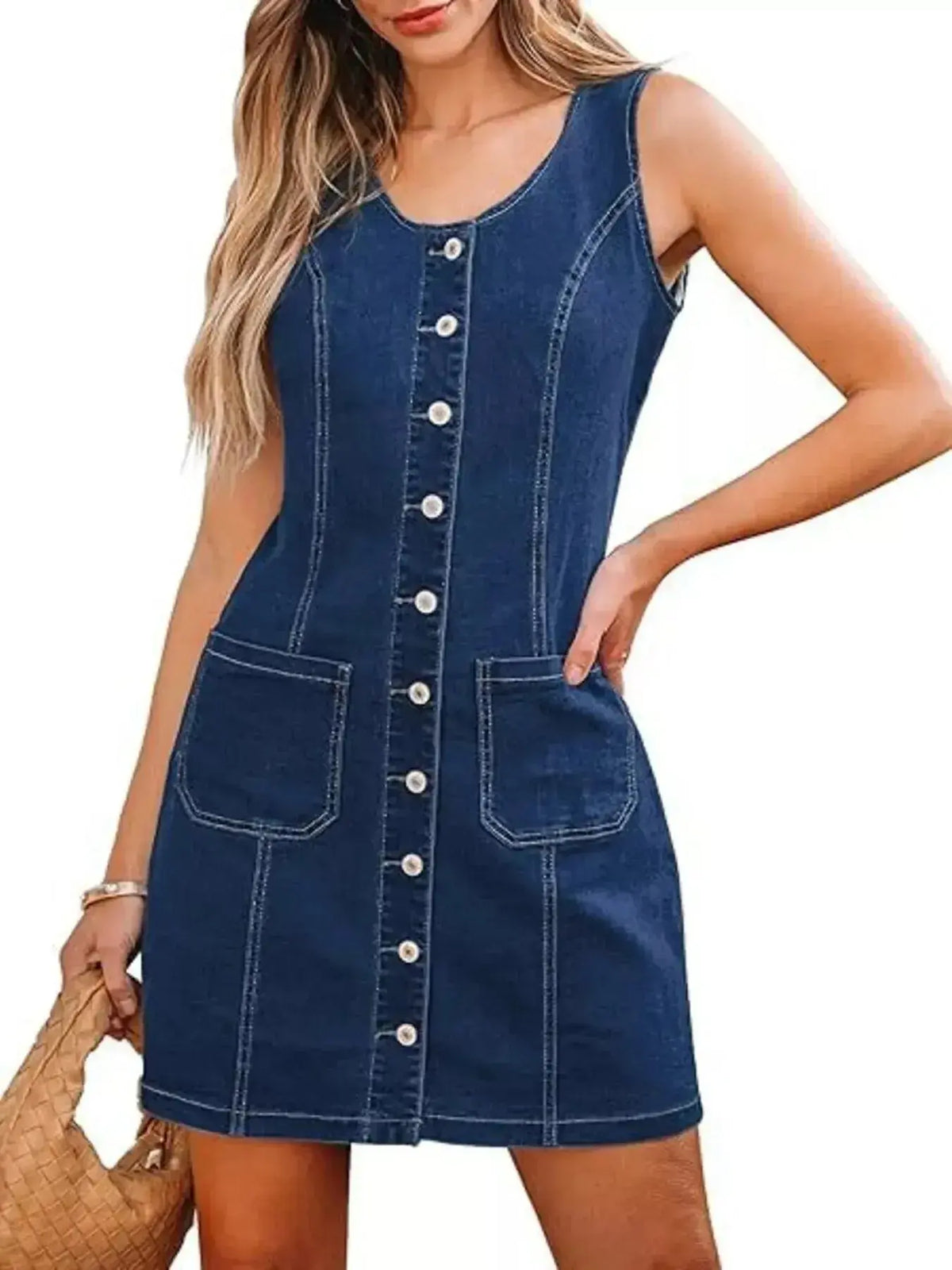 Women's sleeveless denim dress with button-front closure and pockets by Plush Fashion Hub, casual and stylish for warm weather.