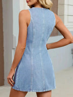 Women's sleeveless denim mini dress with button-front closure, casual summer shift dress by Trendsi, perfect for warm-weather wear.