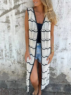 Women’s sleeveless crochet longline cardigan with openwork knit design and button-front vest, stylish sweater by Trendsi.