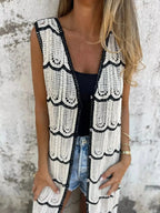 Women's sleeveless crochet longline cardigan with openwork knit pattern and button-front design, trendy Trendsi sweater vest.