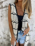 Women's sleeveless crochet longline cardigan with openwork knit and button-front vest, trendy sweater by Trendsi.