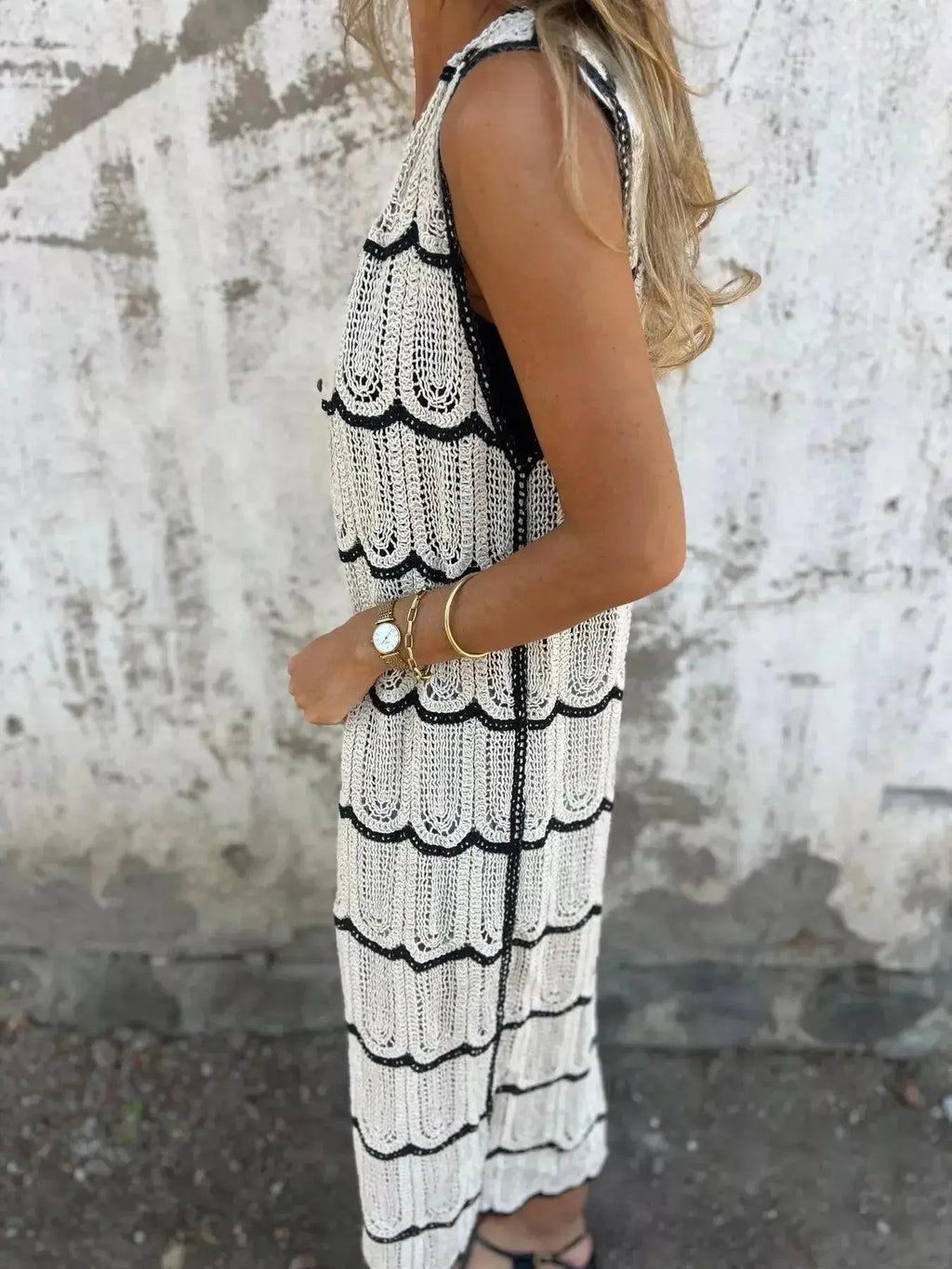 Women’s sleeveless crochet longline cardigan with openwork knit pattern and button-front vest, stylish sweater by Trendsi.