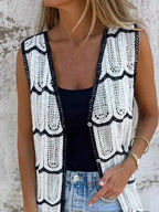 Women's sleeveless crochet longline cardigan with openwork knit pattern and button-front vest, stylish sweater by Trendsi.