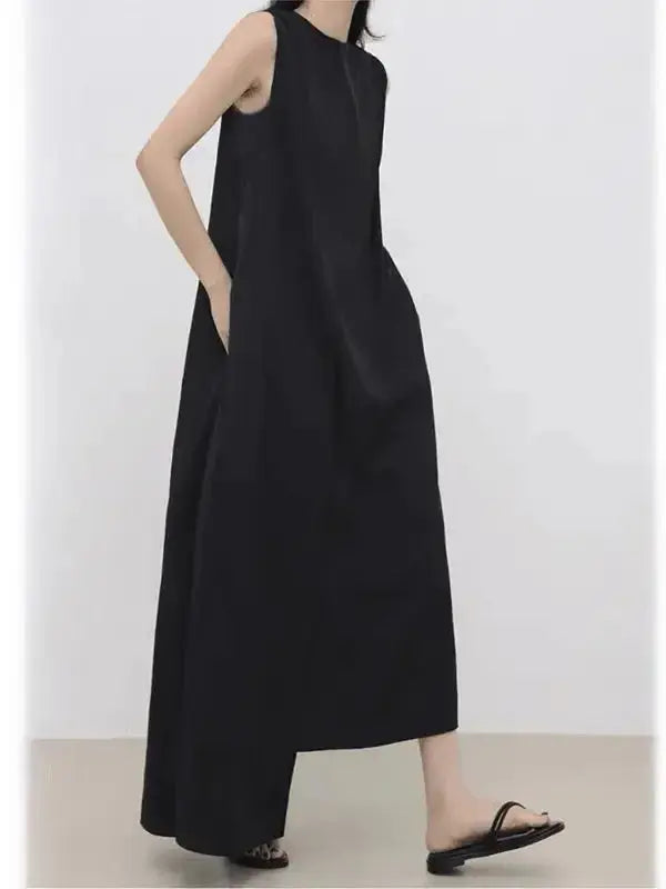 Women’s sleeveless irregular hem long dress in solid color by Plush Fashion Hub, stylish maxi dress with flowing design.