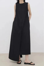 Women’s sleeveless irregular hem long dress in solid color by Plush Fashion Hub, featuring a flowing maxi style and elegant design.