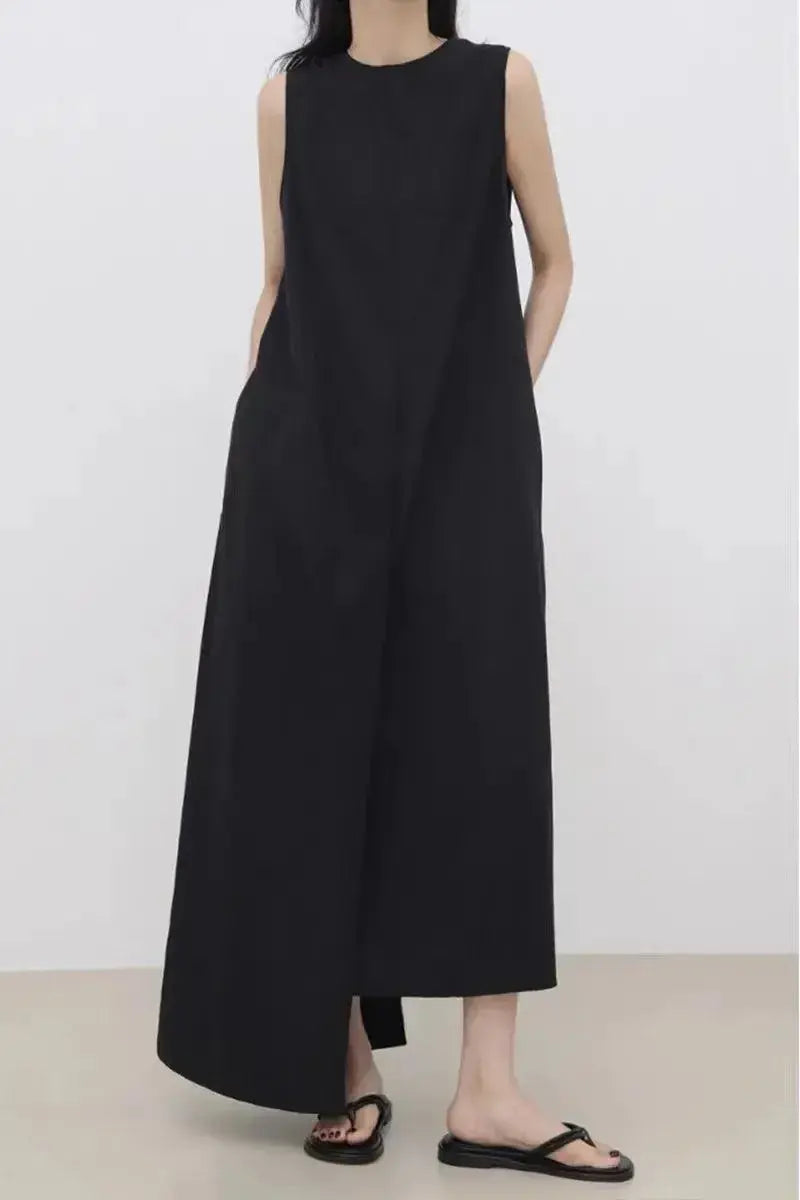 Women’s sleeveless irregular hem long dress in solid color by Plush Fashion Hub, featuring a flowing maxi style and elegant design.