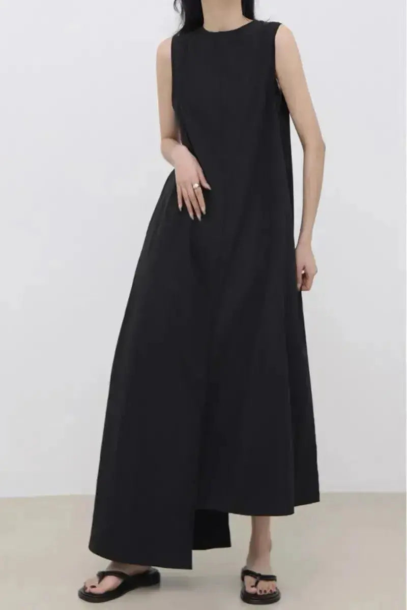 Women’s sleeveless irregular hem long dress in solid color, stylish maxi dress by Plush Fashion Hub.