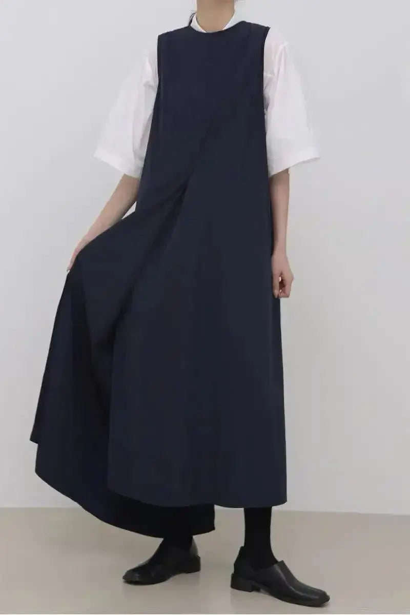 Women’s sleeveless irregular hem long dress in solid color by Plush Fashion Hub, flowing maxi dress with casual elegance.