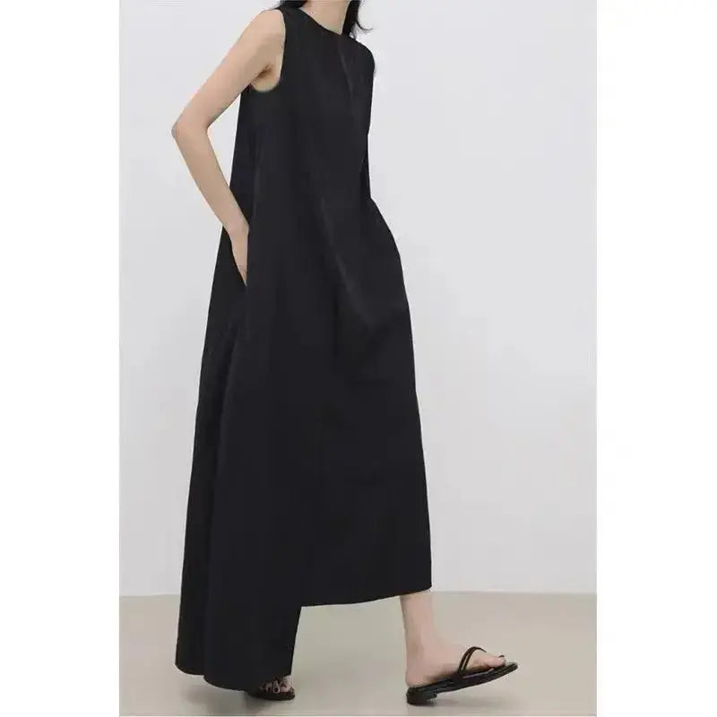 Women’s sleeveless irregular hem long dress in solid color from Plush Fashion Hub, featuring a flowing maxi design.