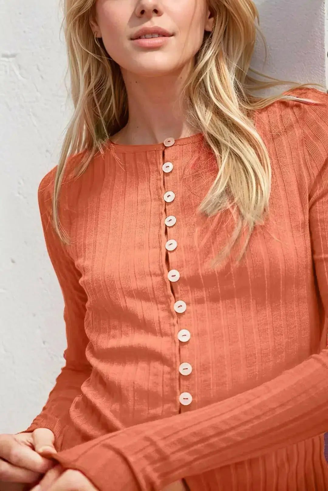 Women’s soft stretch button-up long sleeve top with round neck by Plush Fashion Hub, casual style, shown on a model.