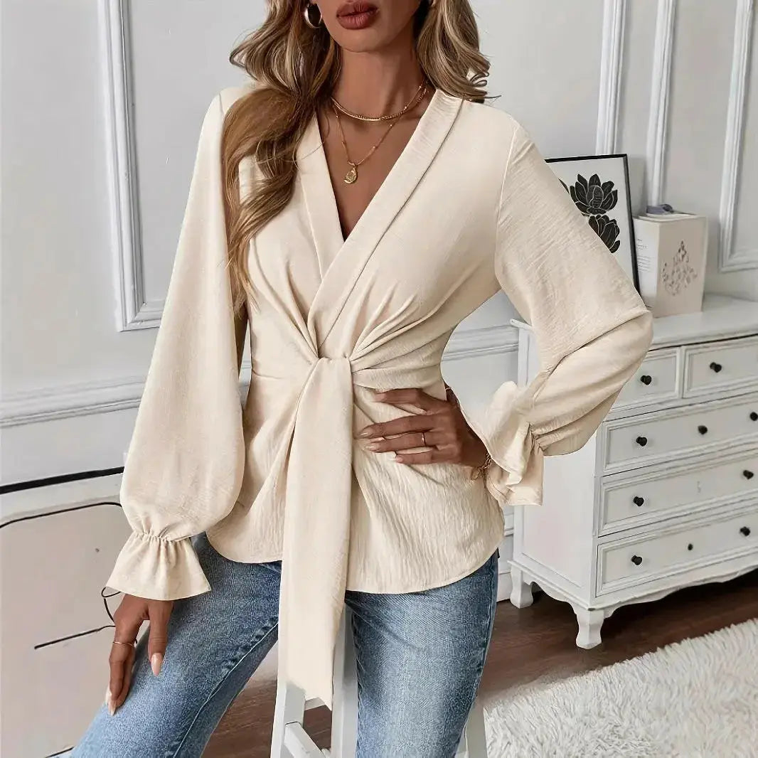 Women’s solid color V-neck long sleeve blouse by Plush Fashion Hub, elegant and stylish top with a flattering fit.