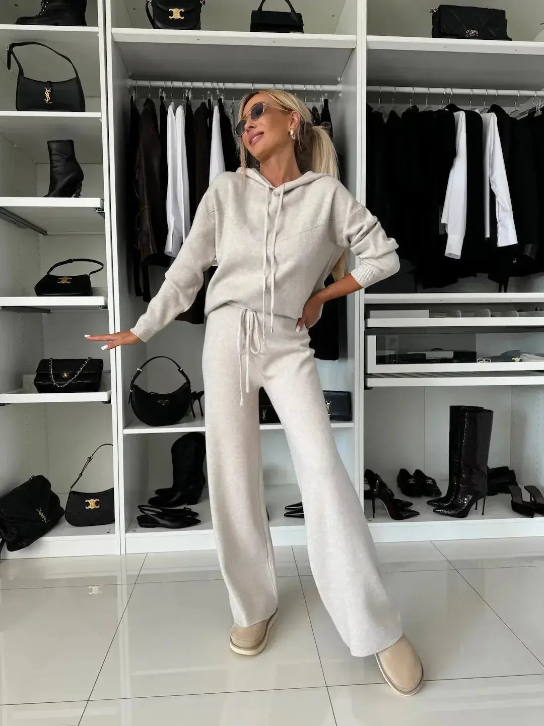 Women’s solid color hooded sweatshirt and wide-leg pants lounge set by Plush Fashion Hub, casual active wear ensemble.