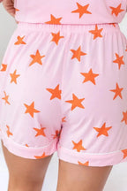 Women's star print short sleeve pajama set by Trendsi with a button-down top and matching shorts, soft and comfortable sleepwear.