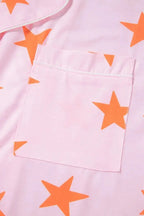 Women's star print short sleeve button-down pajama set by Trendsi, featuring comfortable fabric and a stylish celestial design.