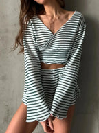 Women's striped long sleeve pajama top and shorts set by Trendsi, featuring soft fabric and cozy sleepwear design.