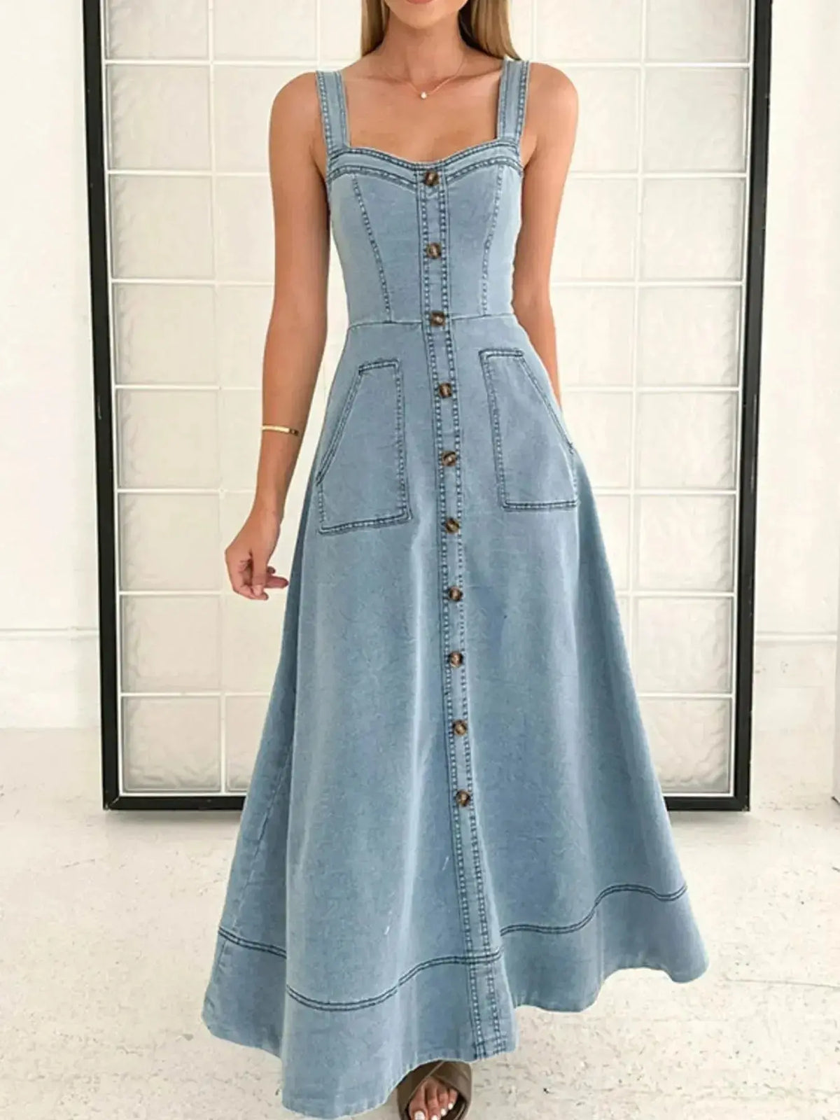 Women's blue denim dress with sweetheart neckline and pockets, casual style by Plush Fashion Hub, featuring a fitted denim design.