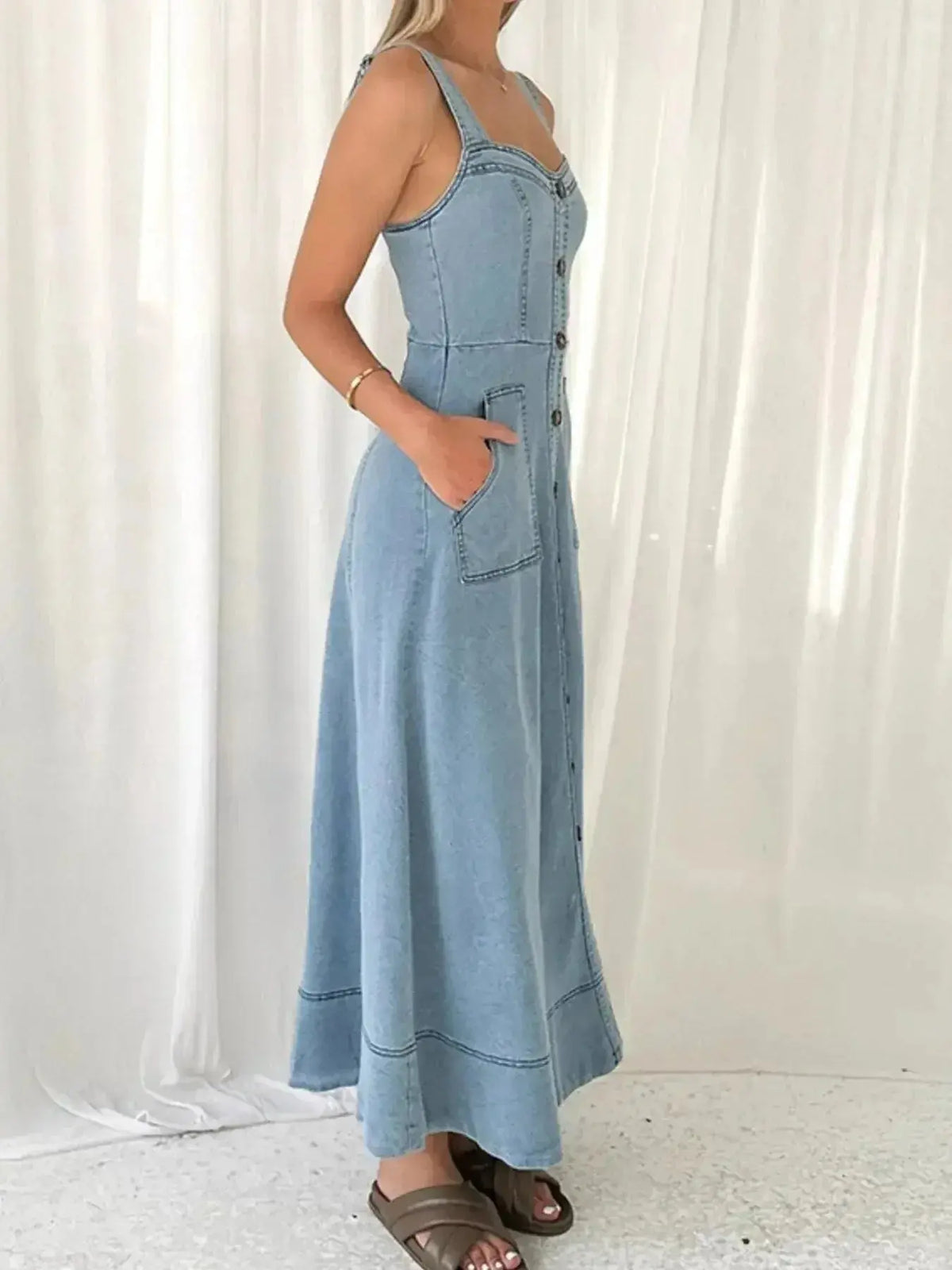 Women’s blue denim sweetheart neck casual jean dress with pockets, featuring a stylish fit and comfortable design by Plush Fashion Hub.