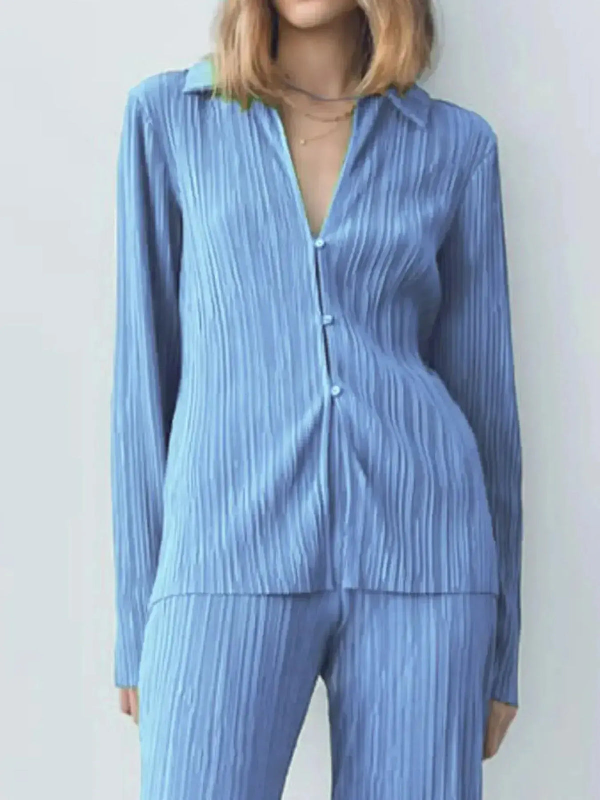Women's textured long sleeve button-up lounge set pajamas by Plush Fashion Hub, cozy two-piece sleepwear for relaxed comfort.