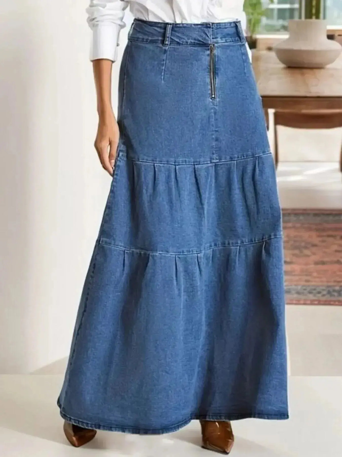 Women's tiered maxi denim skirt with ruched zipper detail by Plush Fashion Hub, featuring a stylish, layered denim design.