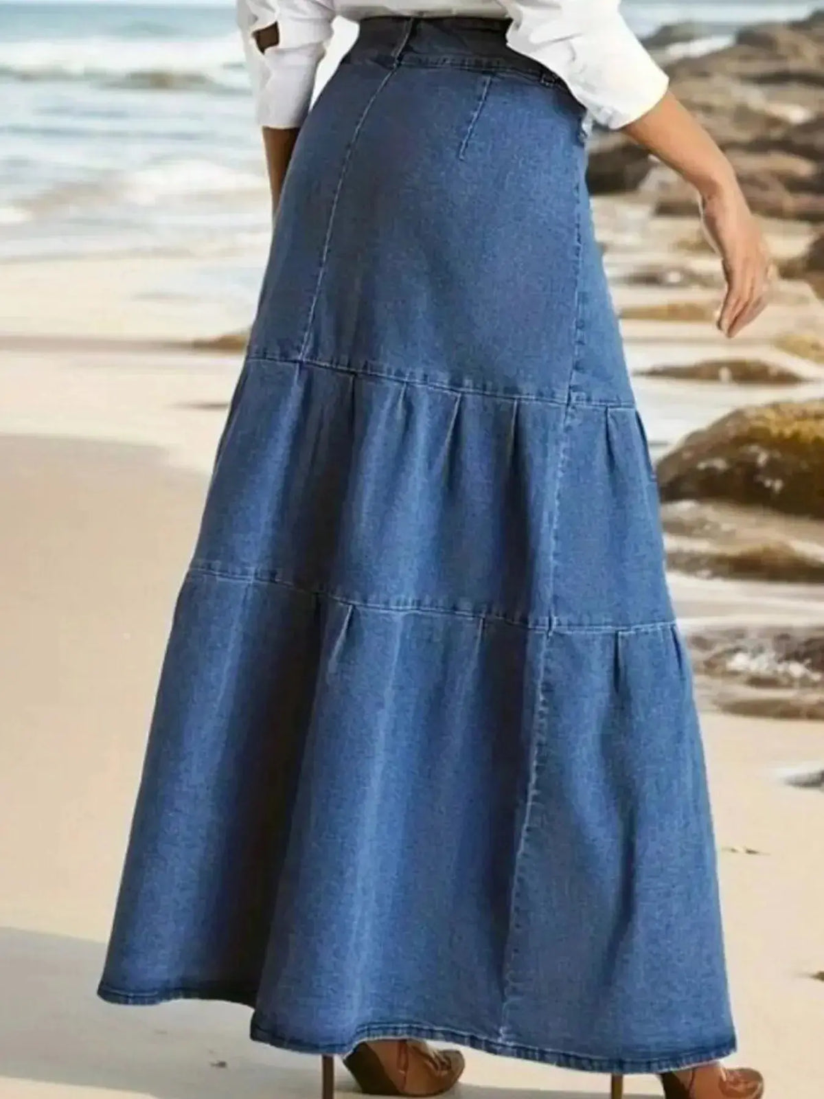 Women’s tiered maxi denim skirt with ruched zipper detail from Plush Fashion Hub, showcasing a stylish, flowy denim skirt design.