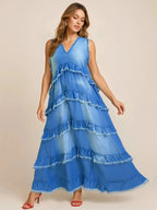 Women's tiered raw hem denim maxi dress by Plush Fashion Hub, featuring casual ruffled design and long length.