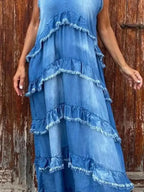 Women wearing a tiered raw hem denim maxi dress with ruffled details, casual style from Plush Fashion Hub.