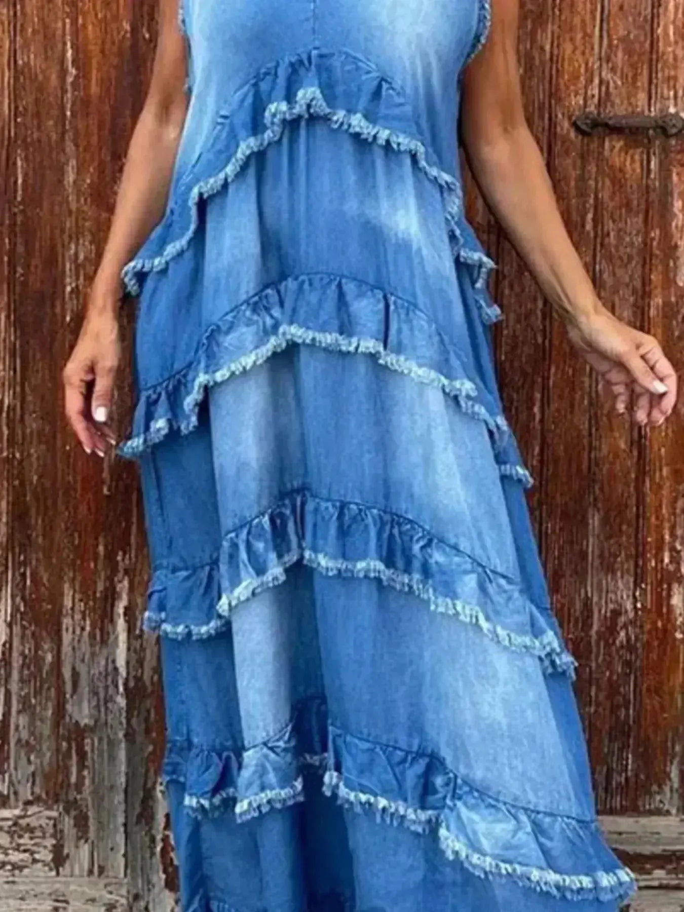 Women wearing a tiered raw hem denim maxi dress with ruffled details, casual style from Plush Fashion Hub.