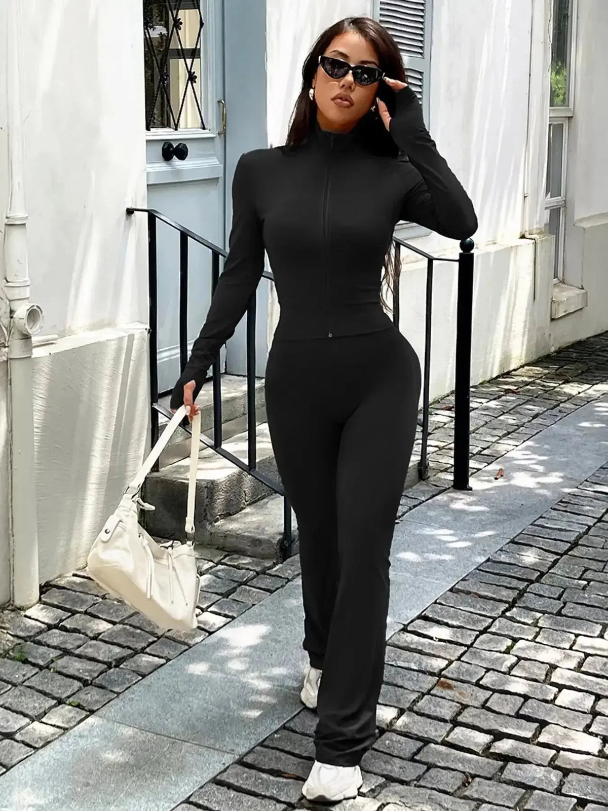 Women’s zip-up long sleeve active sweatsuit two-piece set from Plush Fashion Hub, featuring comfortable fabric and sporty design.