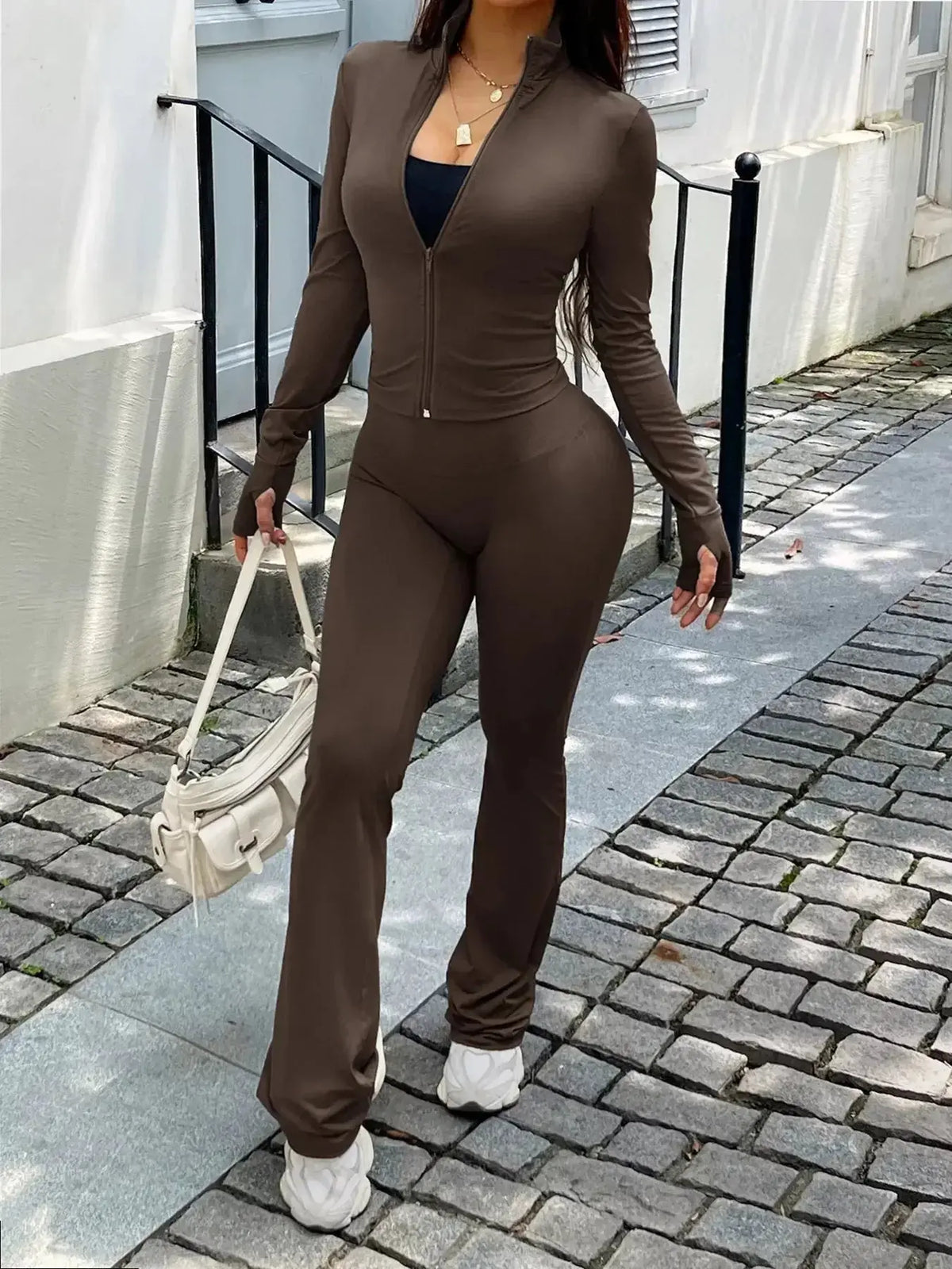 Women's zip-up long sleeve active sweatsuit two-piece set by Plush Fashion Hub, featuring a comfortable fit and casual style.