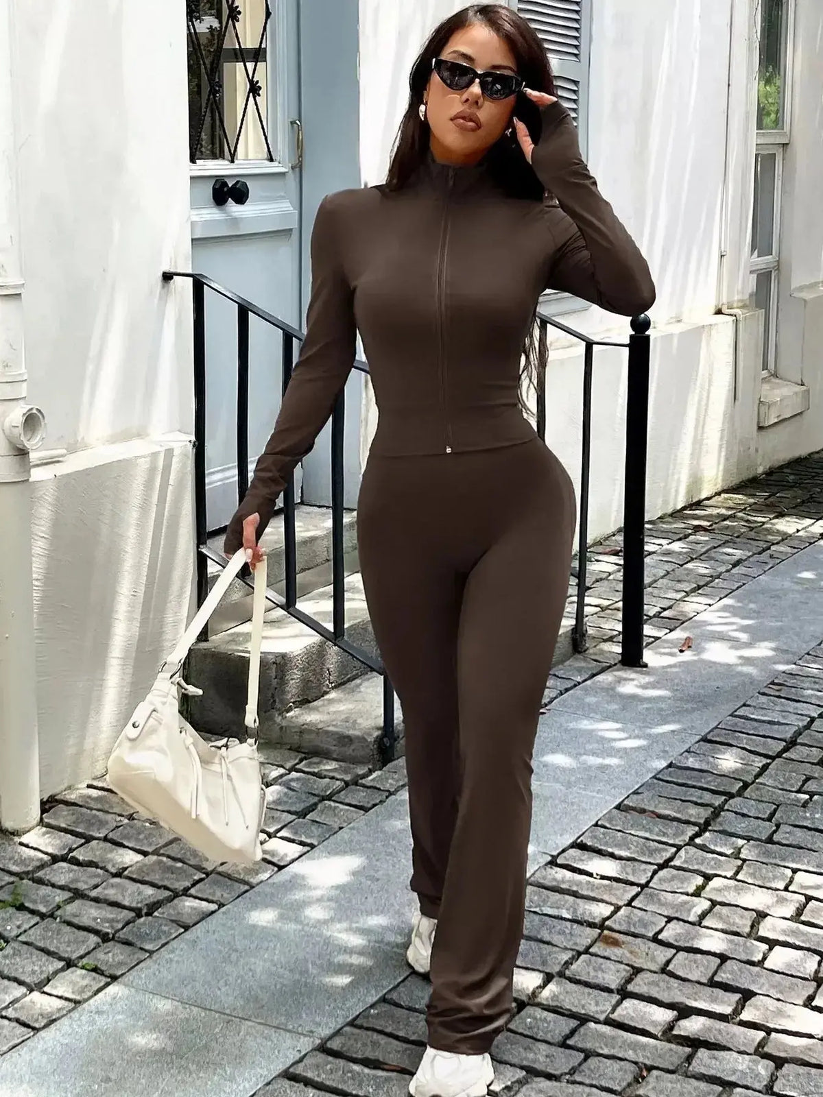 Women’s zip-up long sleeve active sweatsuit two-piece set by Plush Fashion Hub, featuring comfortable fabric and sporty style.
