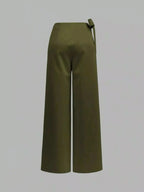Elegant women's wrap waist wide-leg trousers by Plush Fashion Hub, flowing dress pants with a stylish wrap design.