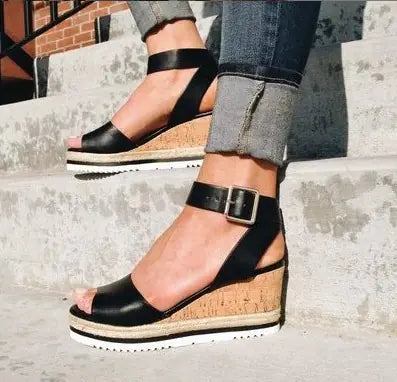 Women’s wedge heel sandals with buckle strap from Trendy Attic Store01, featuring open toe design and ankle strap detail.