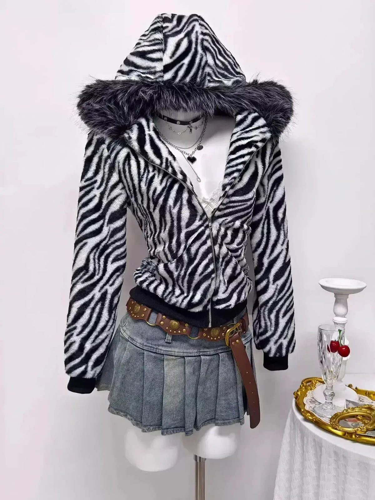 Zebra faux fur hooded zip-up jacket by Plush Fashion Hub featuring a bold zebra print and cozy fur collar.
