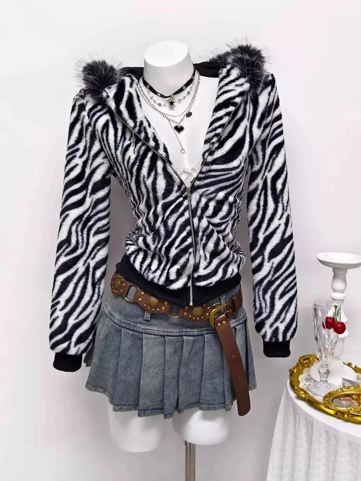 Zebra faux fur hooded zip-up jacket from Plush Fashion Hub featuring a stylish animal print and cozy hood design.