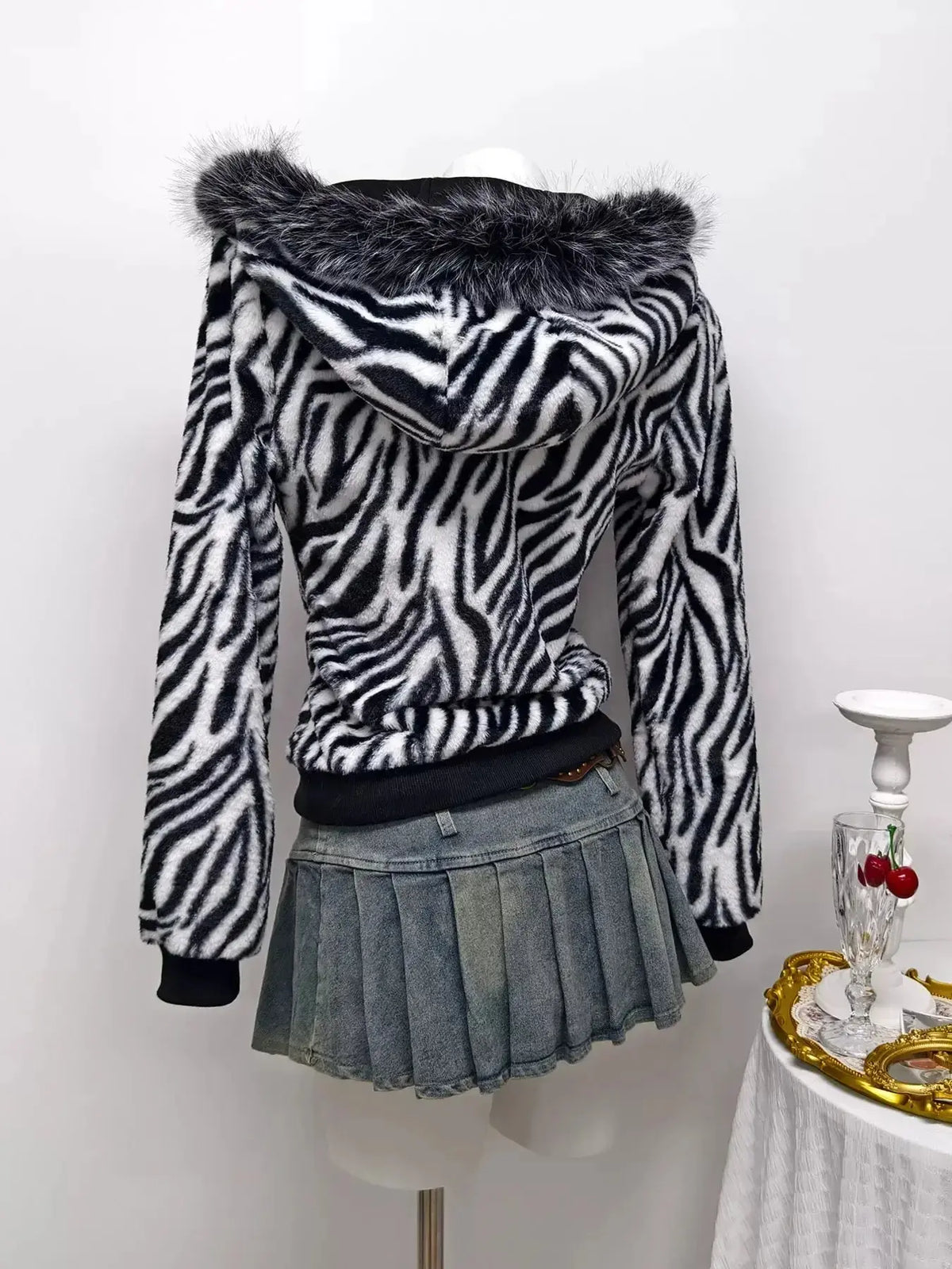 Zebra faux fur hooded zip-up jacket from Plush Fashion Hub featuring a stylish animal print and cozy design.