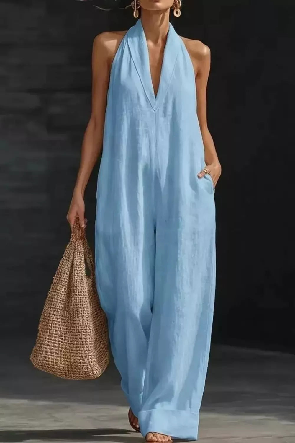 Women's sleeveless wide-leg jumpsuit with pockets by Plush Fashion Hub, shown in a casual romper style with relaxed fit.