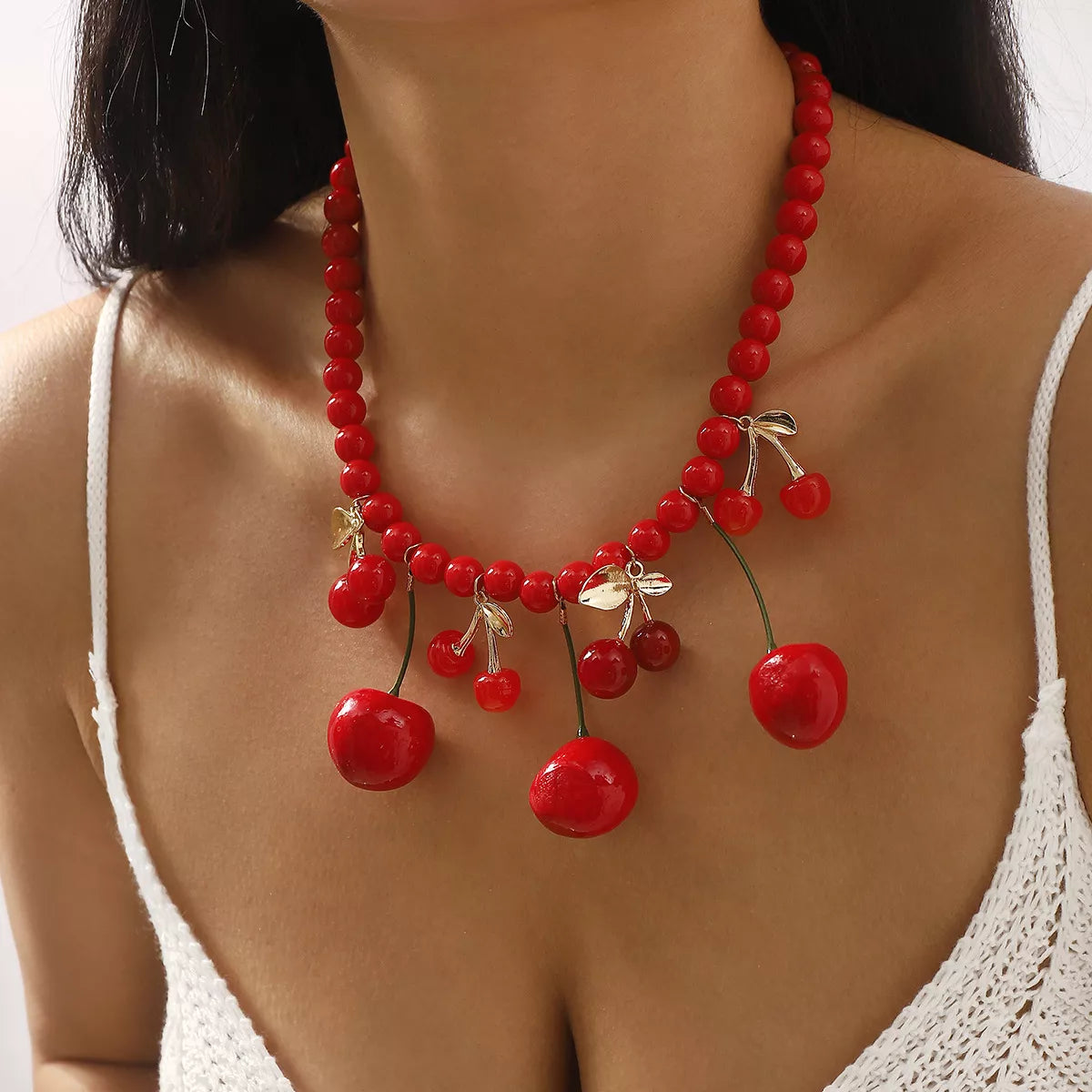 Beaded cherry charm statement necklace by Plush Fashion Hub featuring vibrant red beads and a cherry pendant.