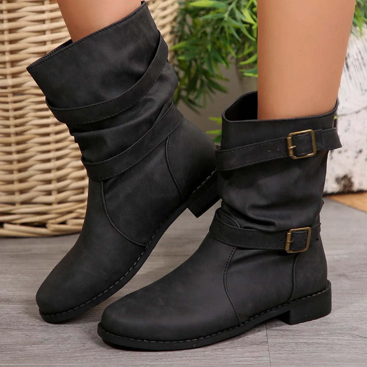 Mid-calf buckle strap boots from Trendsi featuring a stylish design, chunky heel, and multiple buckle accents in black leather.