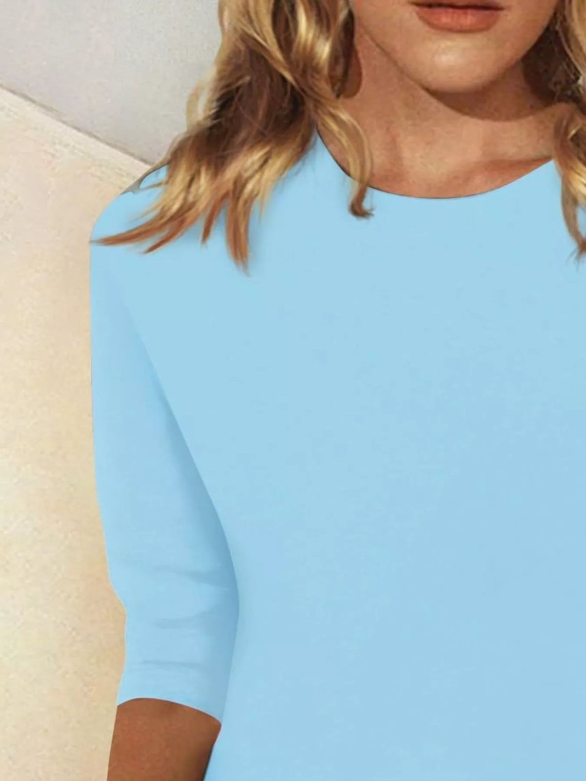 Solid color round neck T-shirt by Plush Fashion Hub, plain design, comfortable fit, showcased on a mannequin.