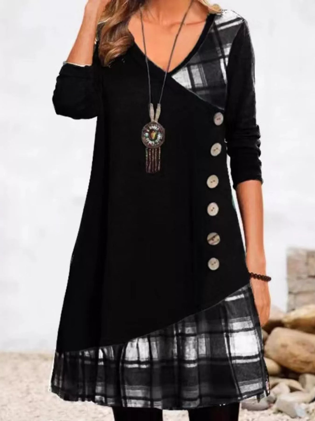 Plus size asymmetrical plaid patchwork long sleeve dress by Trendsi, featuring a stylish design and full-length sleeves.