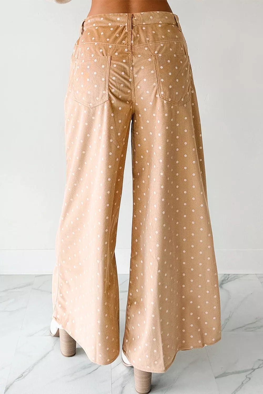Women’s lightweight polka dot wide-leg casual trousers with drawstring waist by Plush Fashion Hub, shown in a relaxed dress style.