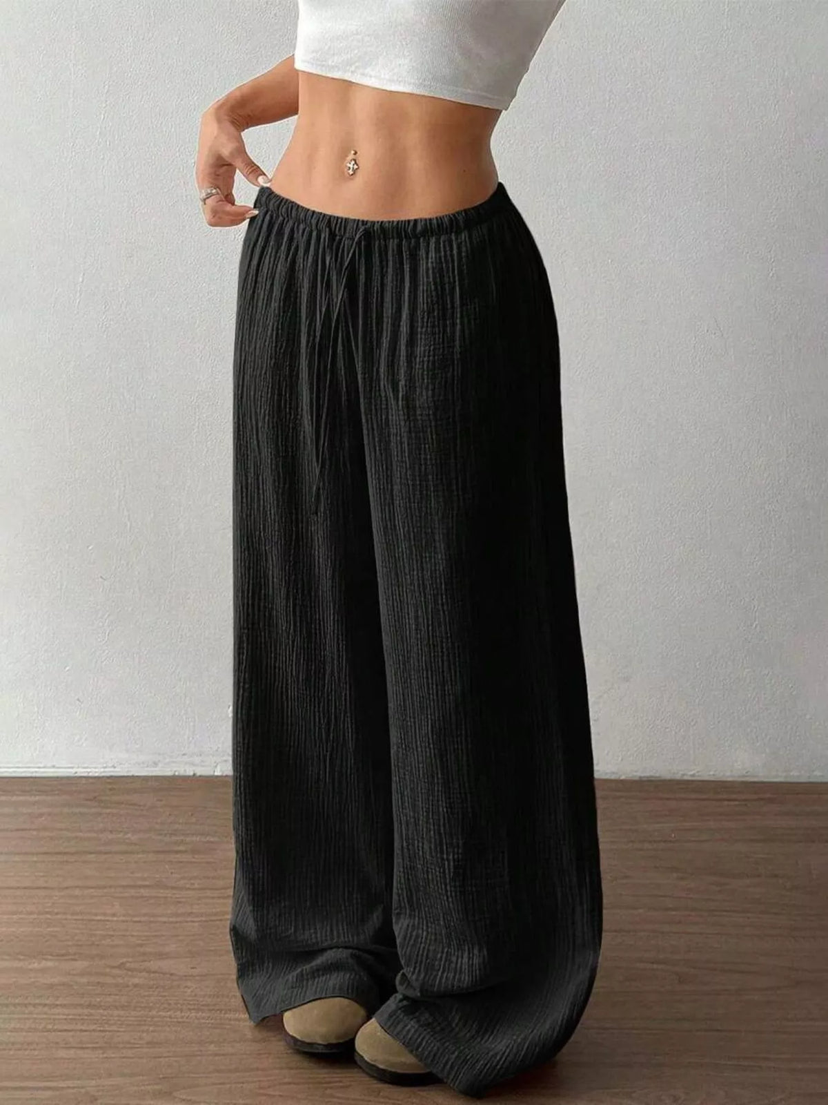 Plush Fashion Hub wide-leg drawstring pants in soft fabric, featuring a relaxed fit and casual style.