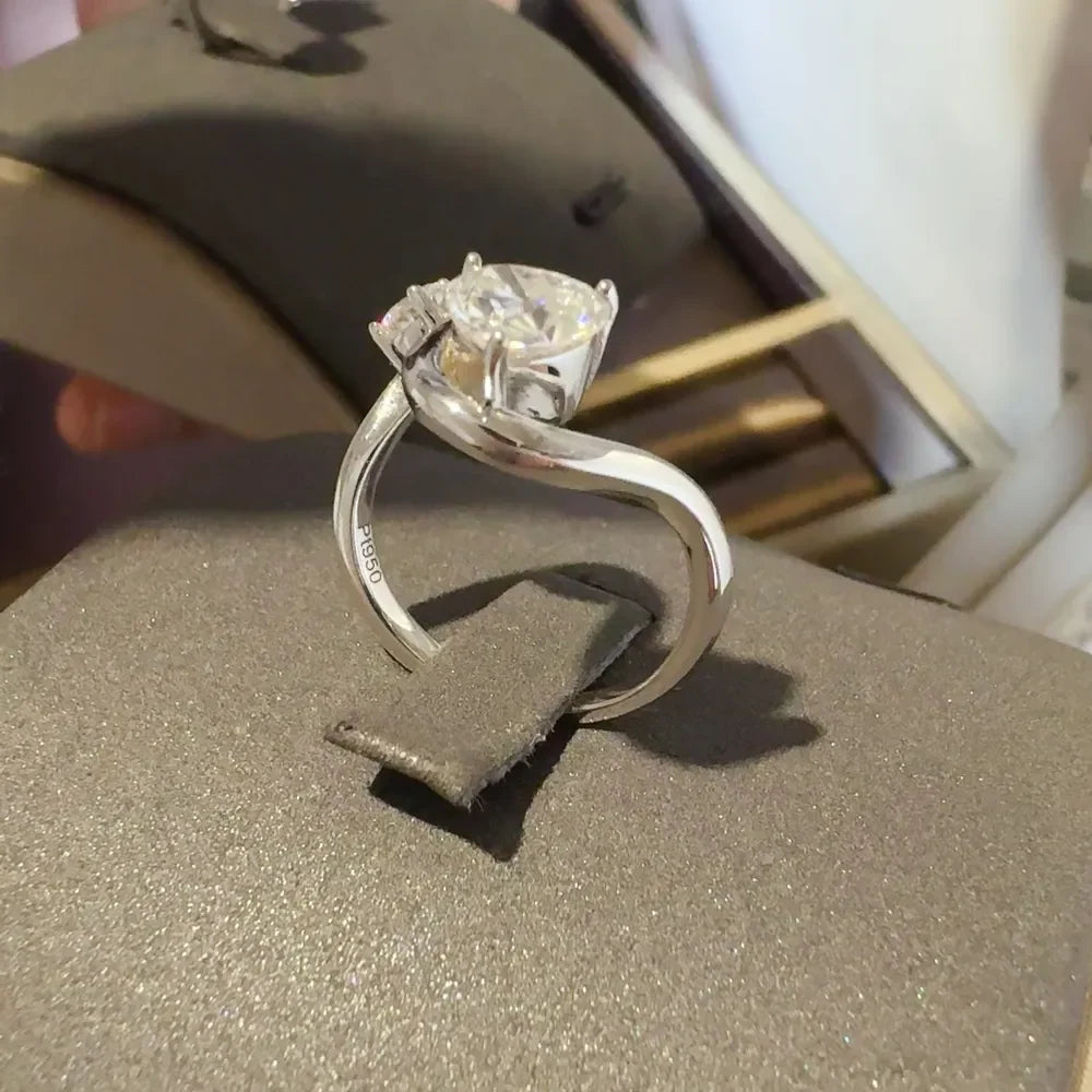 Sterling silver ring with irregular 1.3 carat moissanite gemstone, showcasing a unique, modern design in a close-up view.