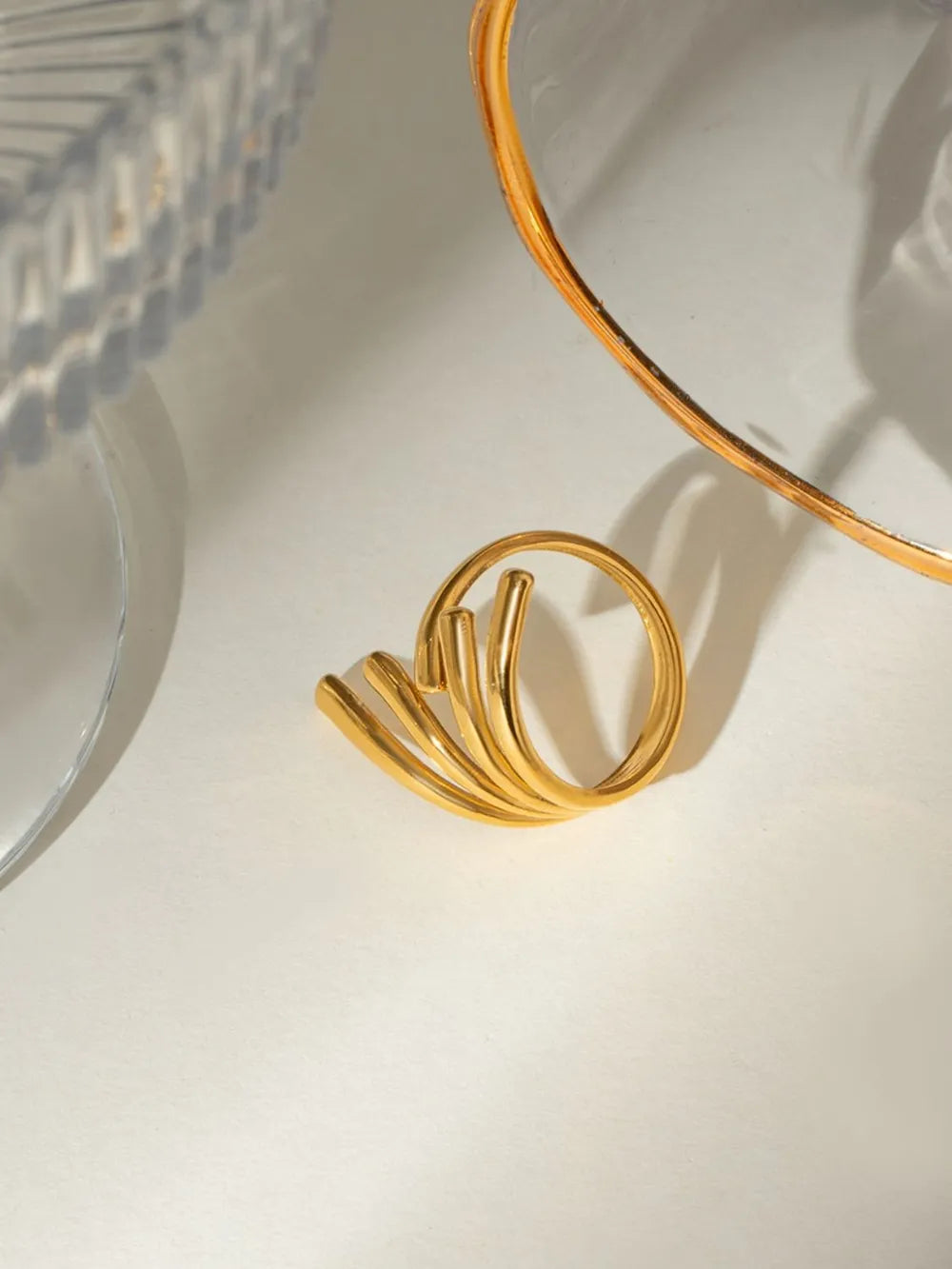 18K gold-plated stainless steel irregular open ring with a modern, minimalist design, displayed on a neutral background.