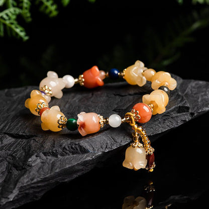 Natural Xinjiang Gold Silk Magnolia BraceletIntroducing our Natural Xinjiang Gold Silk Magnolia Bracelet, made with authentic Jinsi Jade from the Xinjiang province. This exquisite ethnic style bracelet featureBracletPlush Fashions ShopPlush Fashion Shop