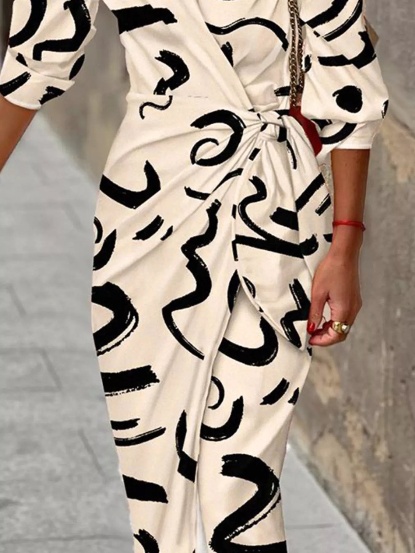 Printed collared neck shirt dress by Trendsi, featuring a button-up front, long sleeves, and a stylish, casual design.