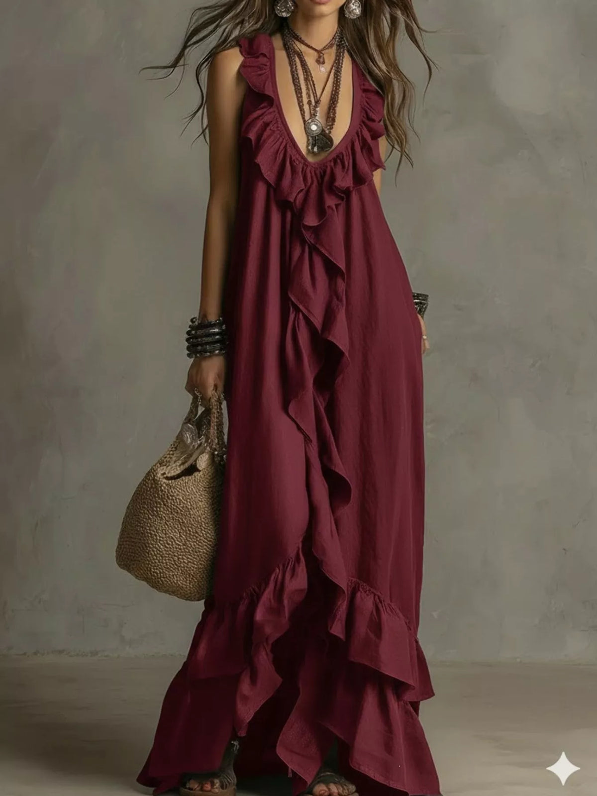 Ruffled sleeveless maxi dress by Plush Fashion Hub featuring flowing fabric and elegant design on a model.