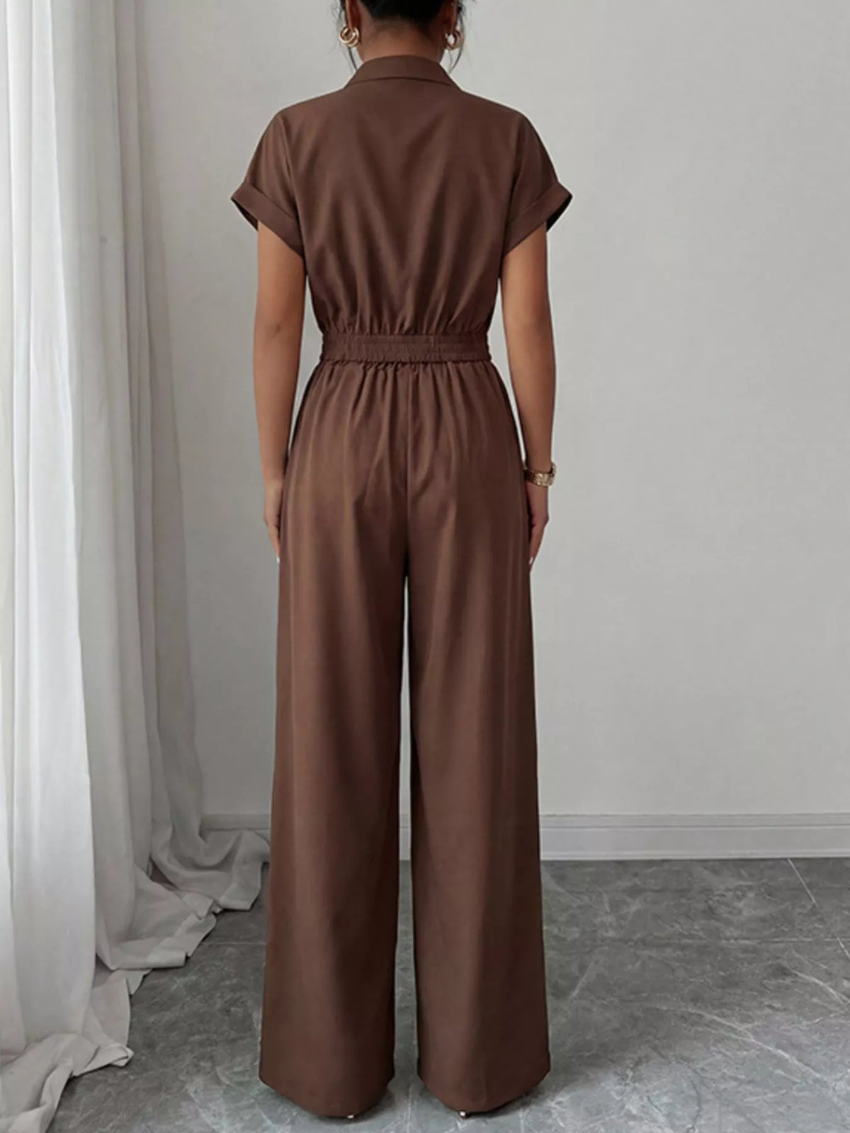 Plush Fashion Hub cargo pocket zipper front jumpsuit, casual style with front zipper and multiple cargo pockets, dark fabric.