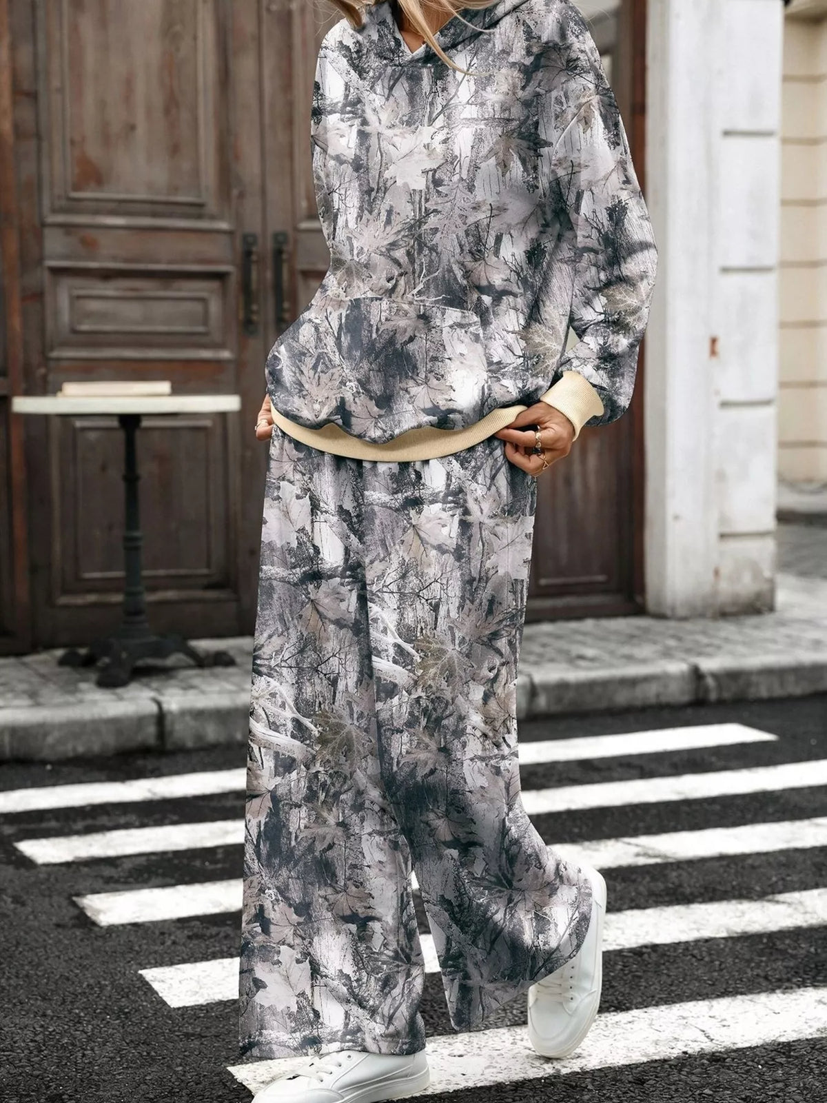 Printed long sleeve hoodie and pants set by Trendsi, featuring a stylish design, comfortable fit, and casual loungewear style.